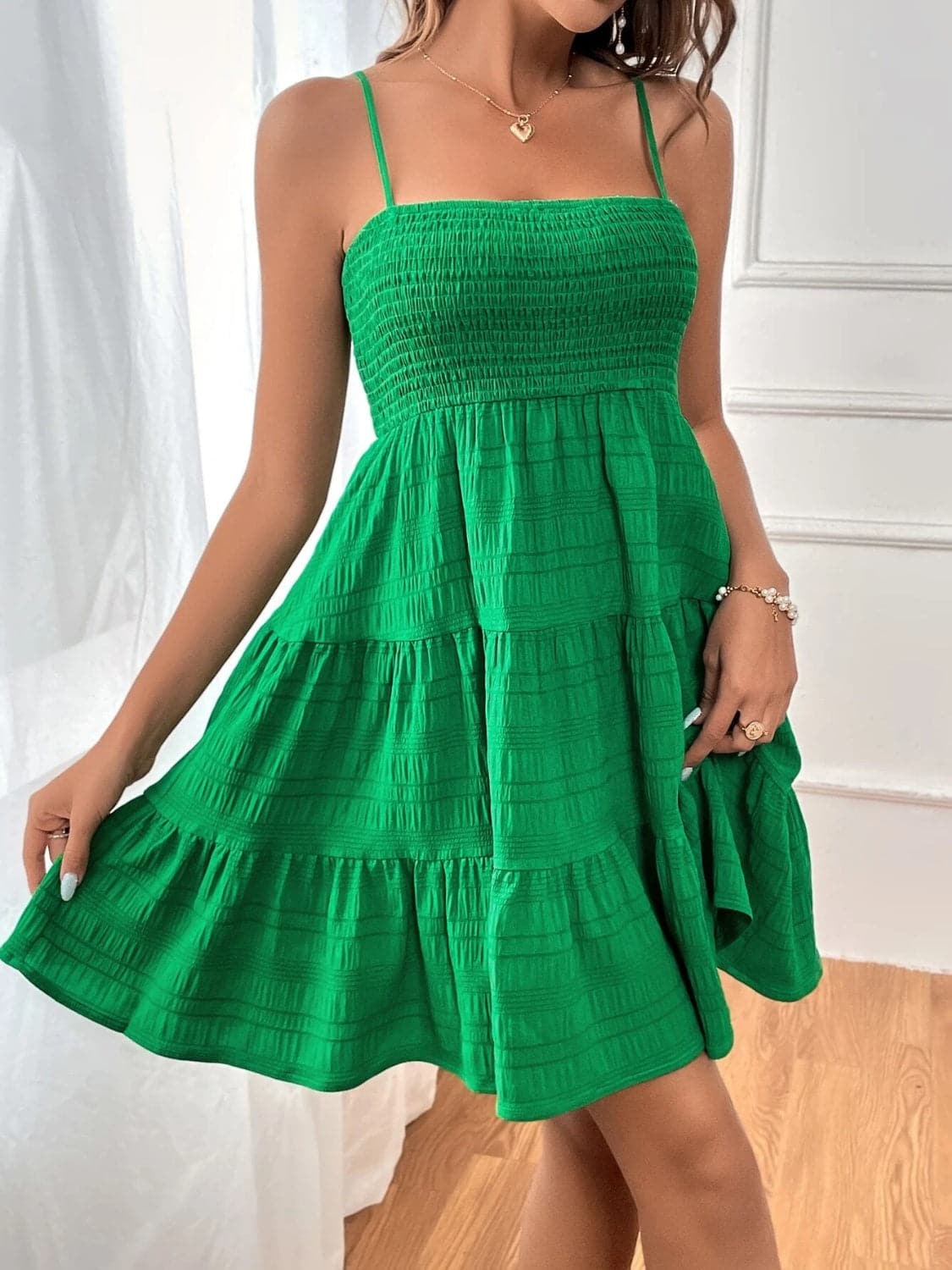 Smocked Tiered Sleeveless Mini Dress.