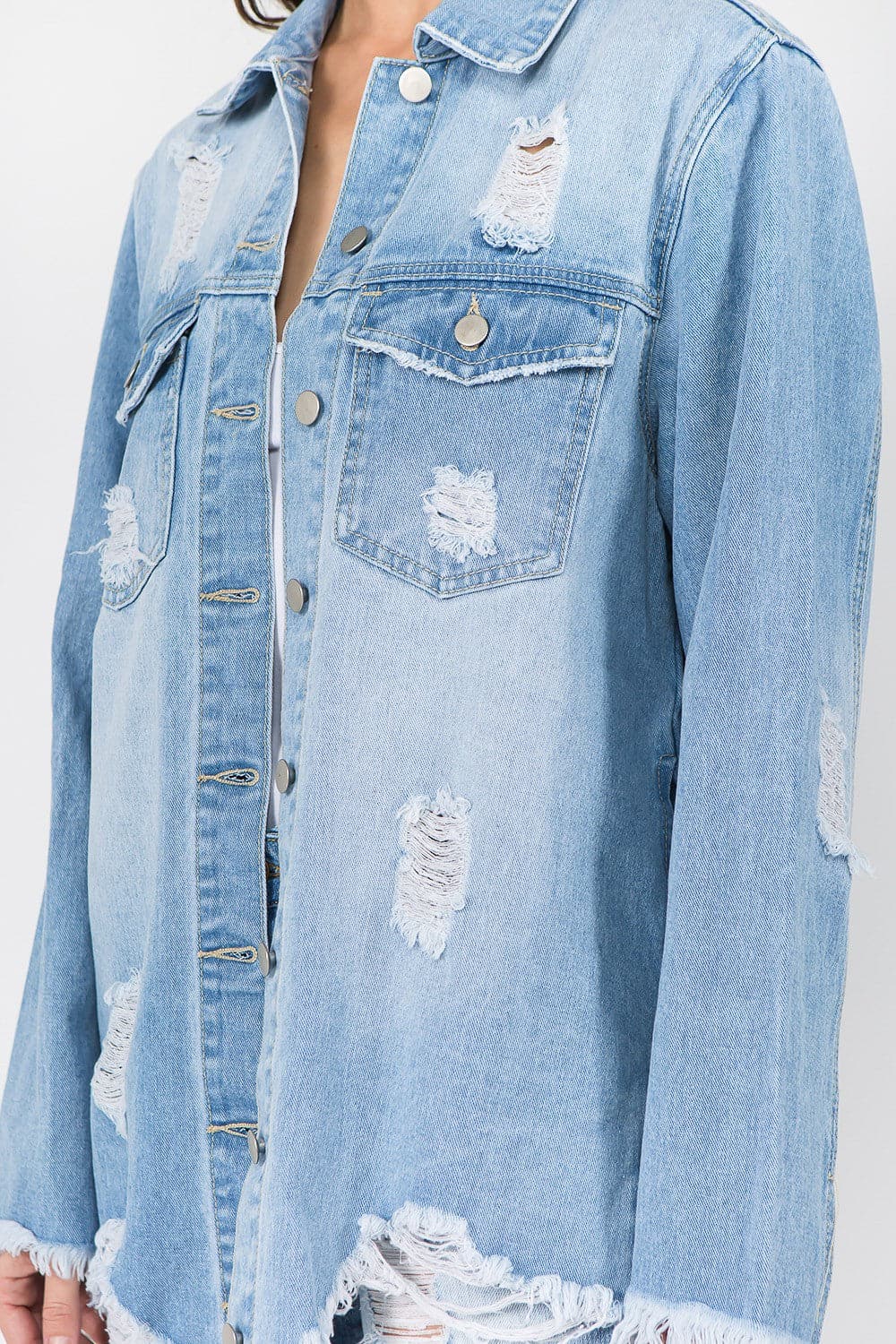 Chic distressed denim jacket with frayed hem