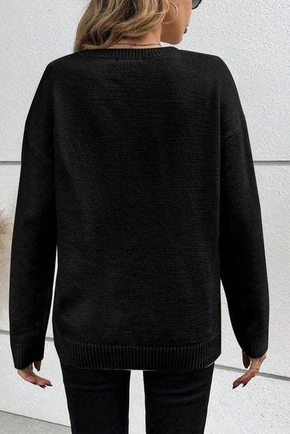 Cozy black "Boo" knitted sweater with ribbed edges for casual style