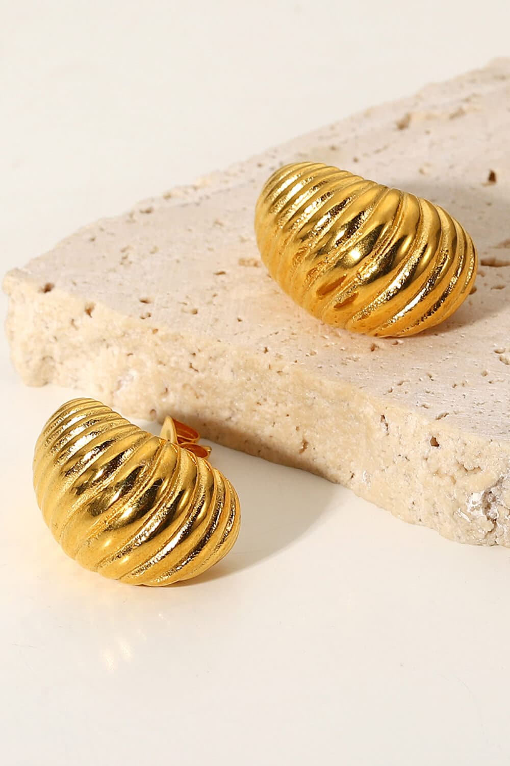 Seashell-inspired spiral stud earrings for elegant charm