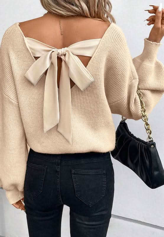 Tied Back V-Neck Long Sleeve Sweater with bow detail and chic design.