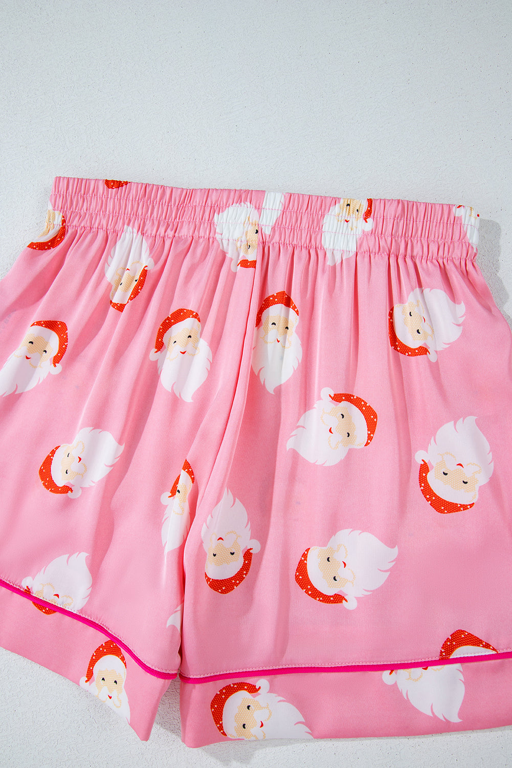 Festive pink satin Santa Claus loungewear set with shorts and long sleeves