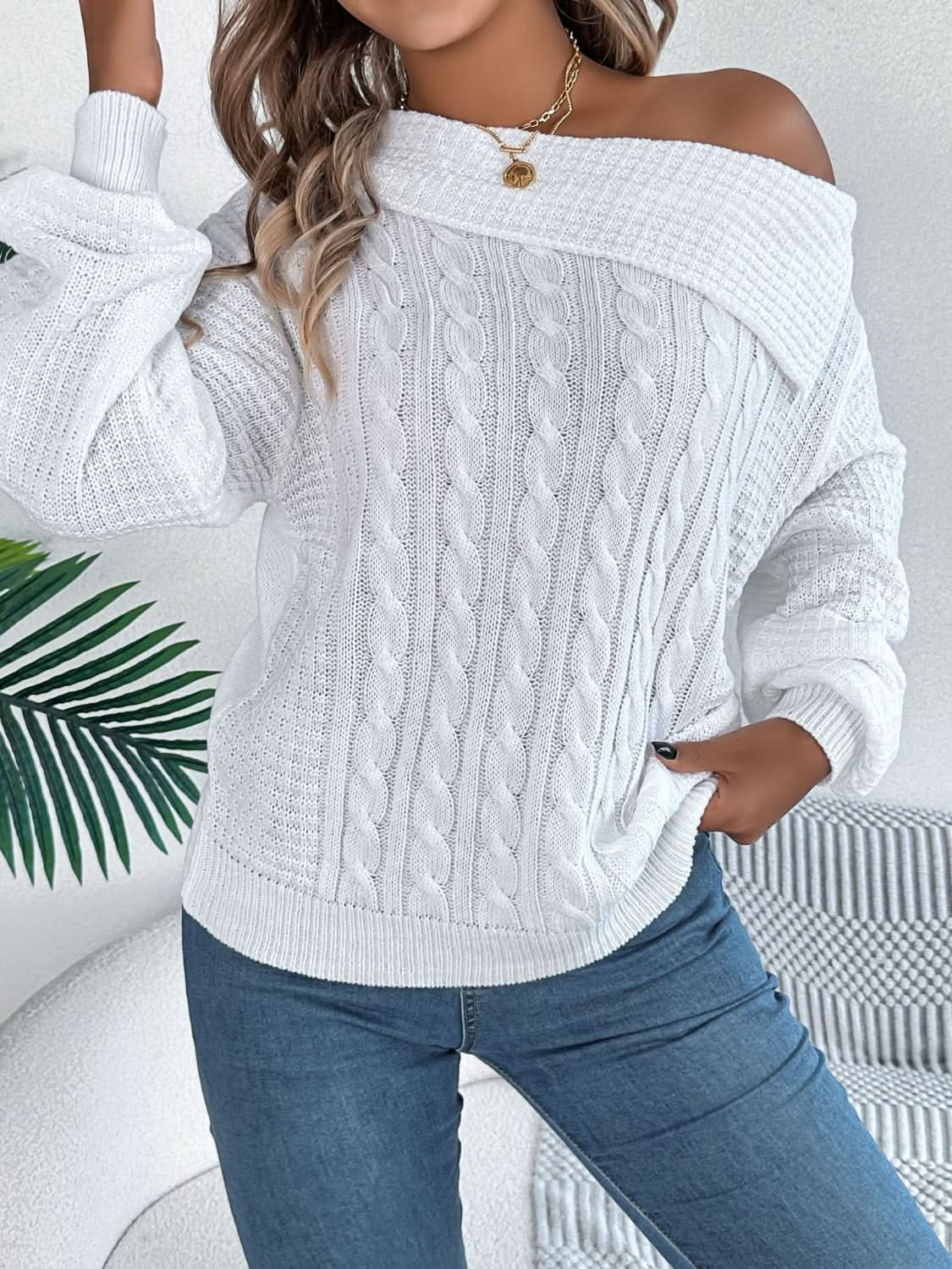 Asymmetrical cable-knit long sleeve sweater