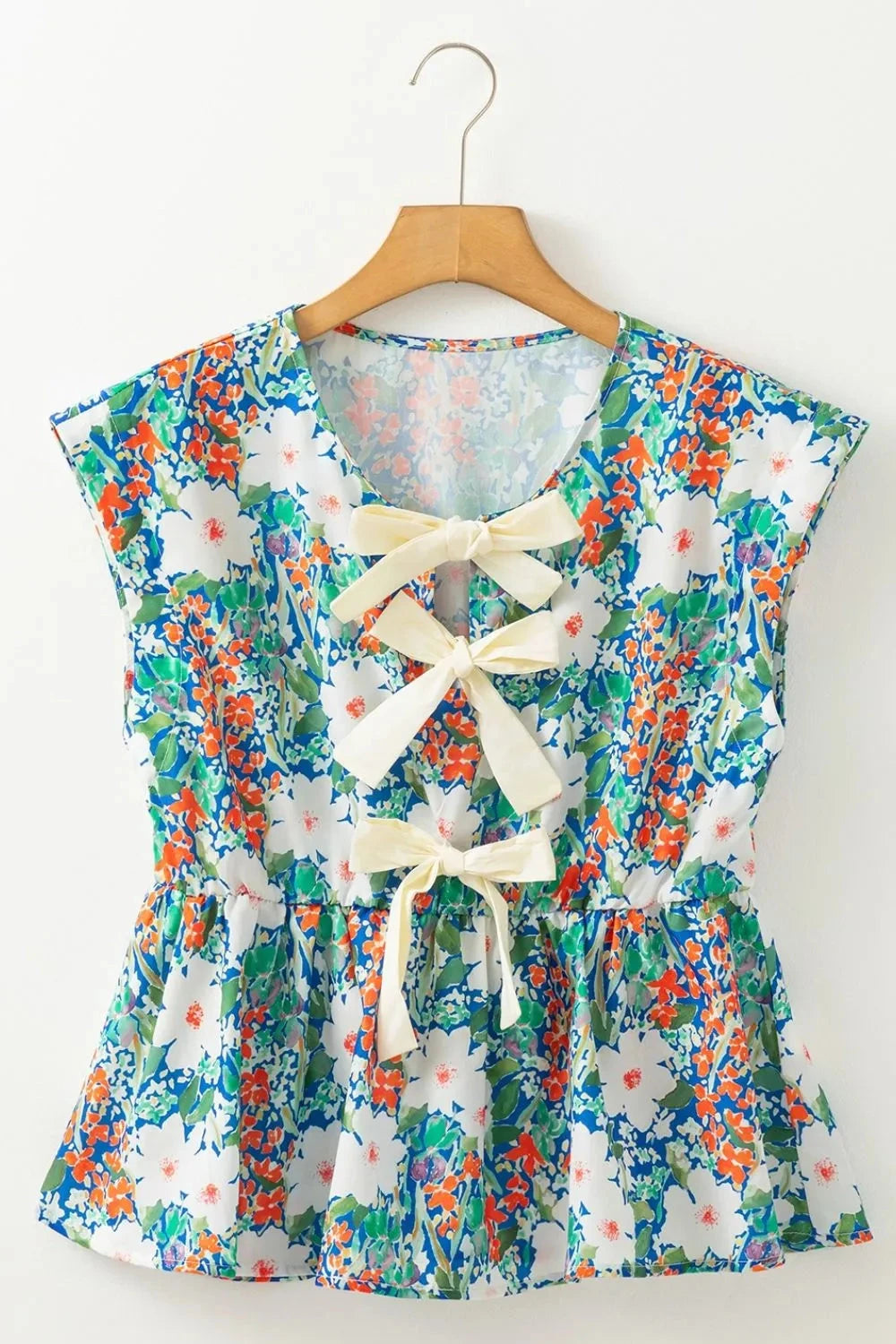 Floral Print Bow Applique Slit Sleeveless Peplum Blouse Simply Love