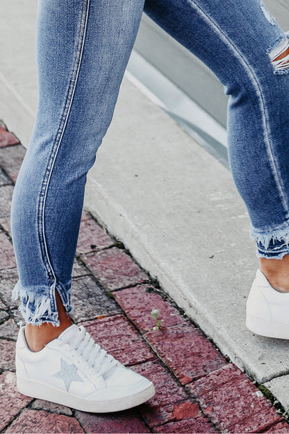 Retro light blue frayed ankle skinny jeans with a distressed finish