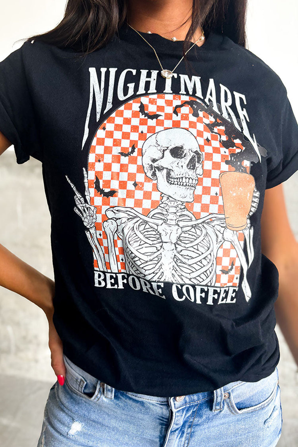 Chilling skull and checkerboard Halloween graphic tee