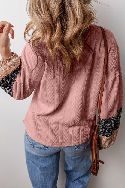 Dusty pink floral patchwork v-neck blouse with textured knit and drawstring detail