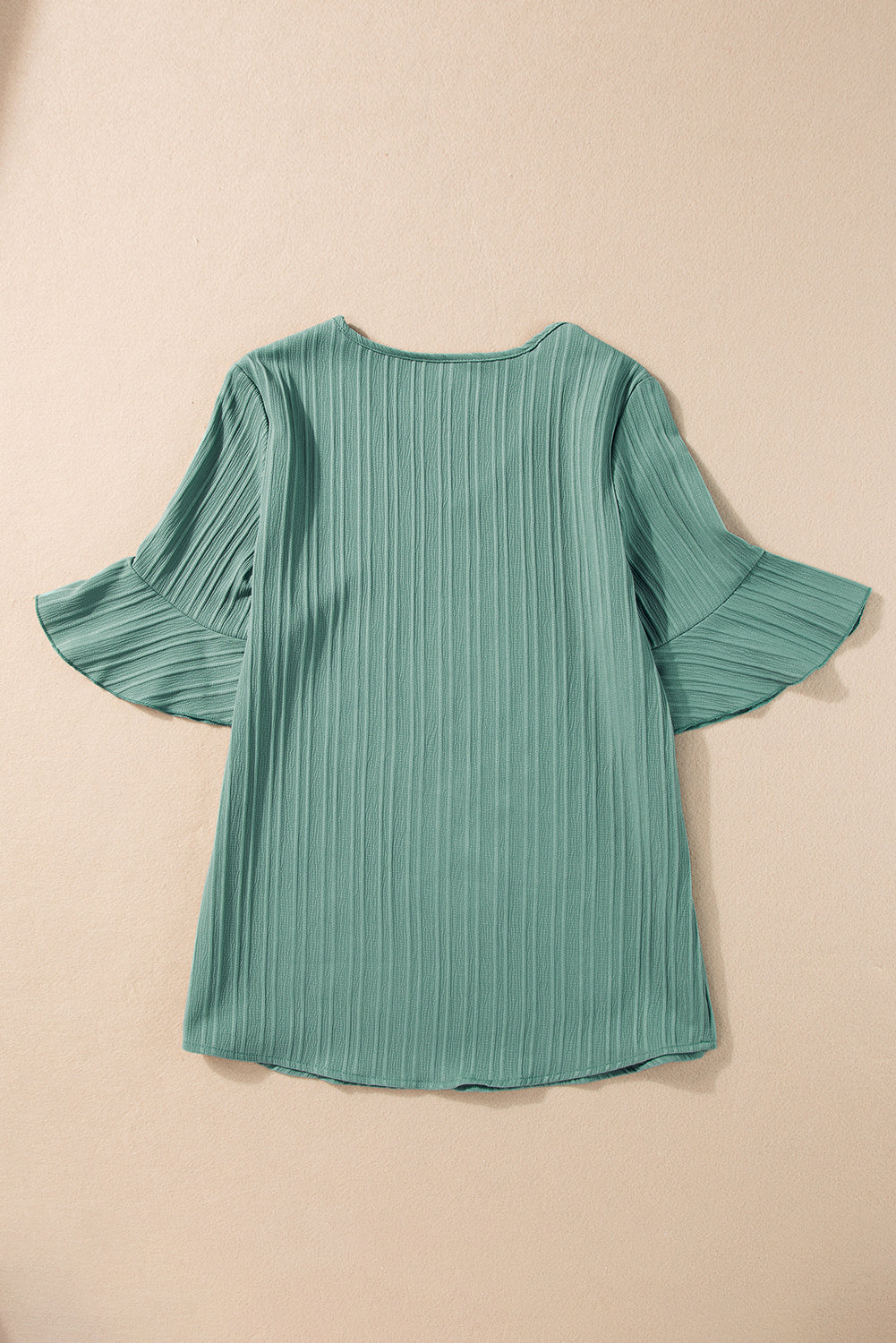 Chic grass green ruffled top with half sleeves and v-neck detail