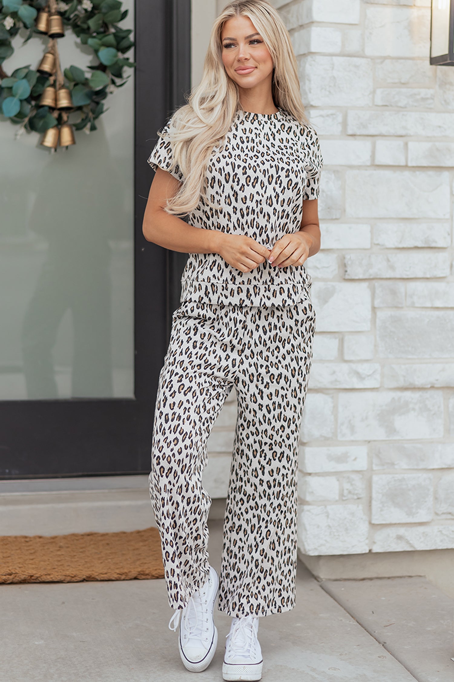 Dear-Lover Beige Leopard Print two piece set on a model, showcasing the relaxed fit of the tee and wide-leg pants for summer.