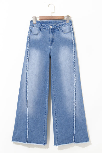 Vintage-inspired Beau Blue flared jeans with raw hem detailing