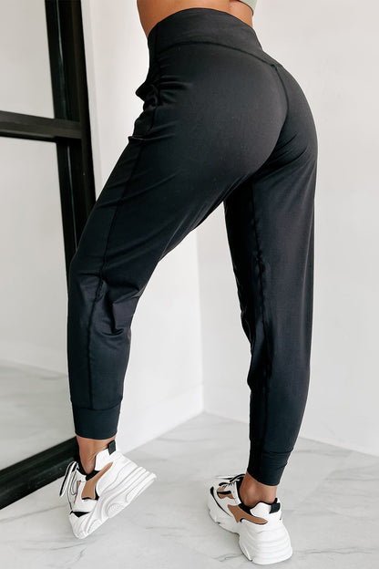 Modern high-waisted joggers with exposed seams and pockets