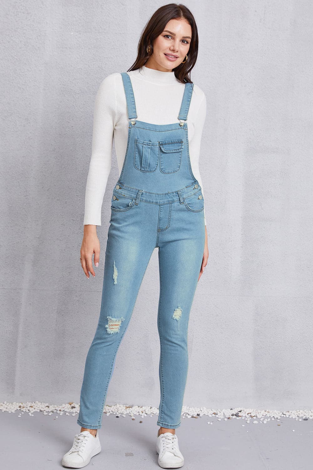 Distressed Washed Denim Overalls with Pockets.