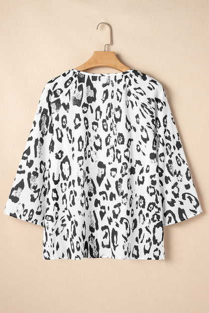 Fierce and Flirty Black Leopard Print Blouse with Ruched V-Neck