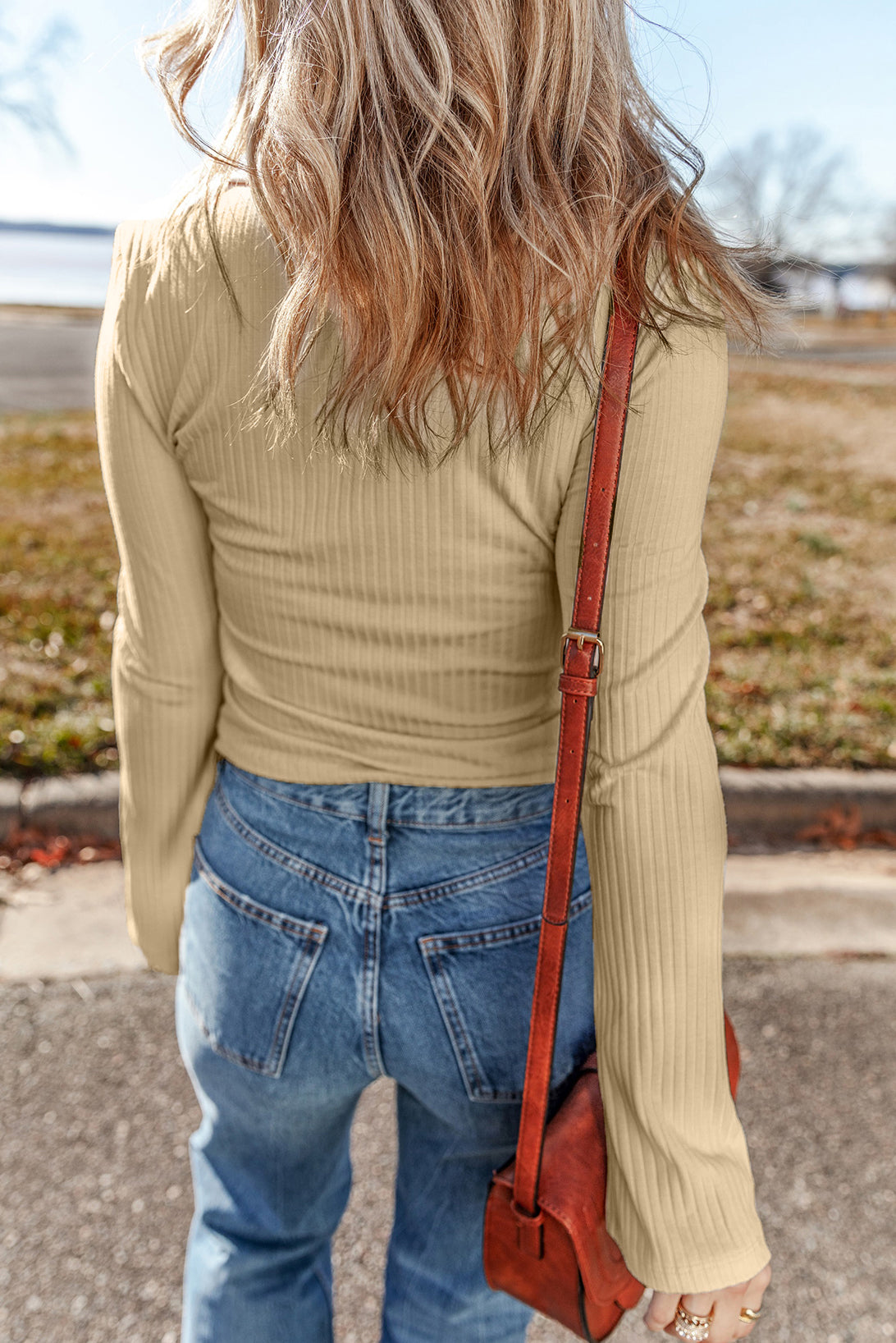 Chic beige ribbed long sleeve top with buttoned collar