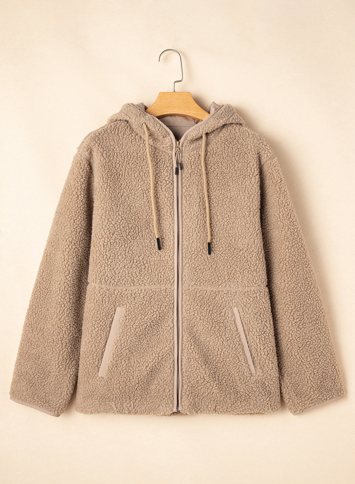 Detail of the practical pockets on the Love Salve Hooded Fleece Jacket, designed for convenience and cozy comfort.