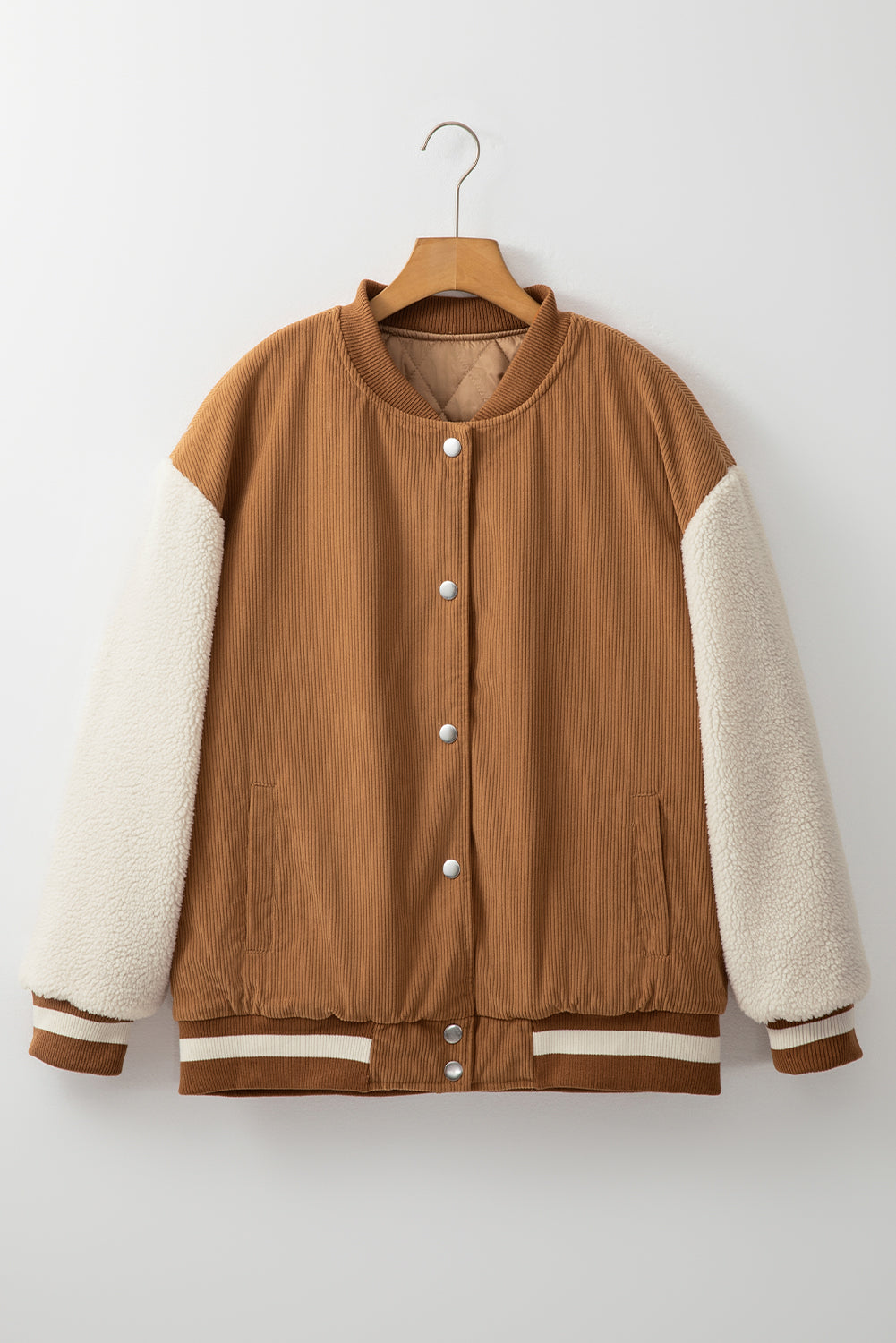 Buckskin corduroy fleece bomber with faux shearling sleeves and varsity-striped trim.