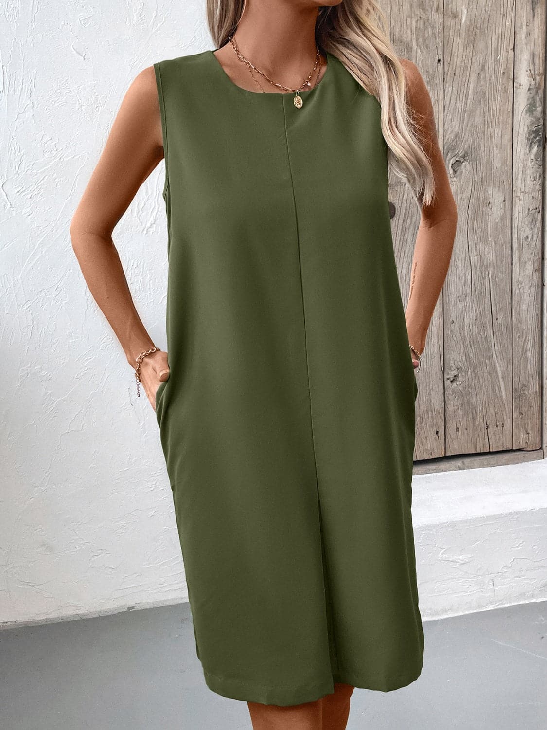 Pocketed Round Neck Sleeveless Mini Dress.