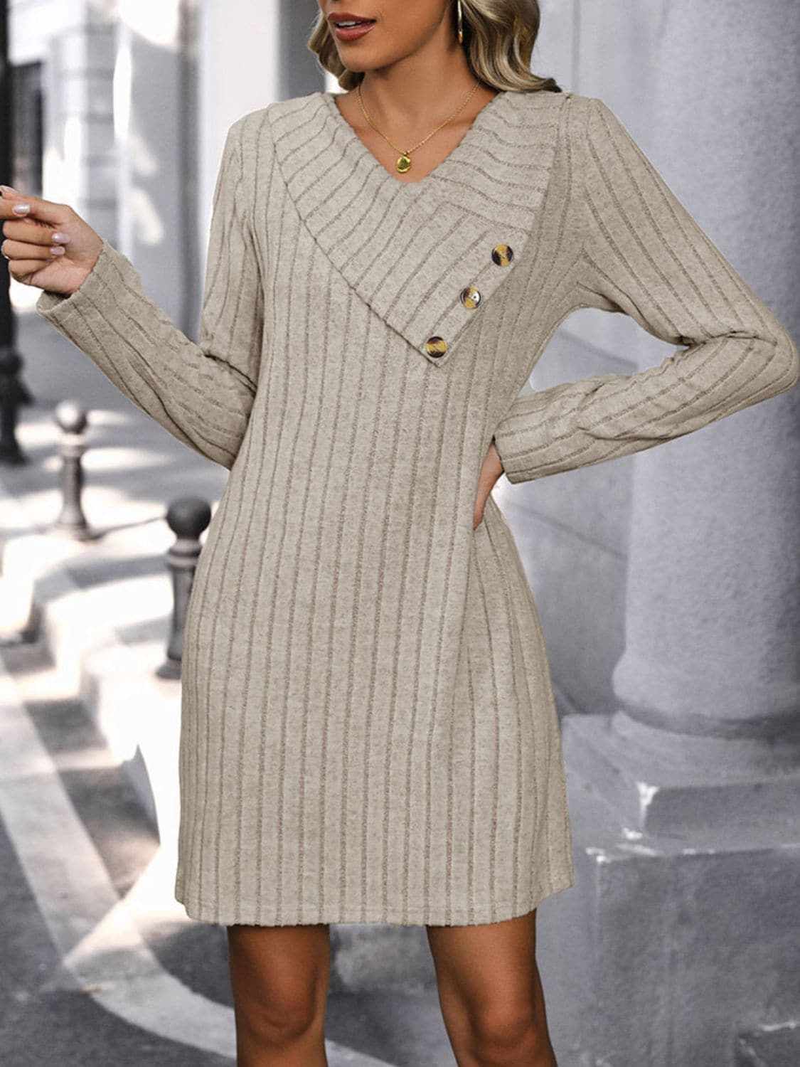 Chic v-neck long sleeve dress with decorative buttons and ribbed texture.