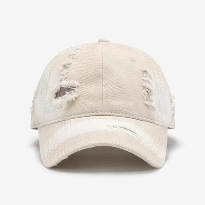 Distressed adjustable cotton baseball cap with edgy design and comfortable fit.