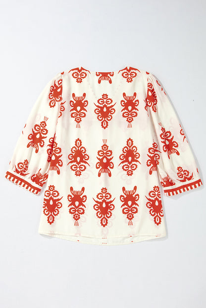 Chic orange geometric print V-neck blouse with 3/4 sleeves