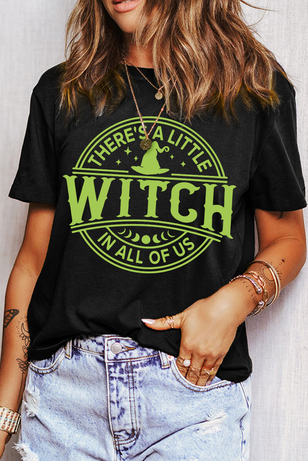 Enchanting Black Witch Graphic Tee for Halloween Celebrations