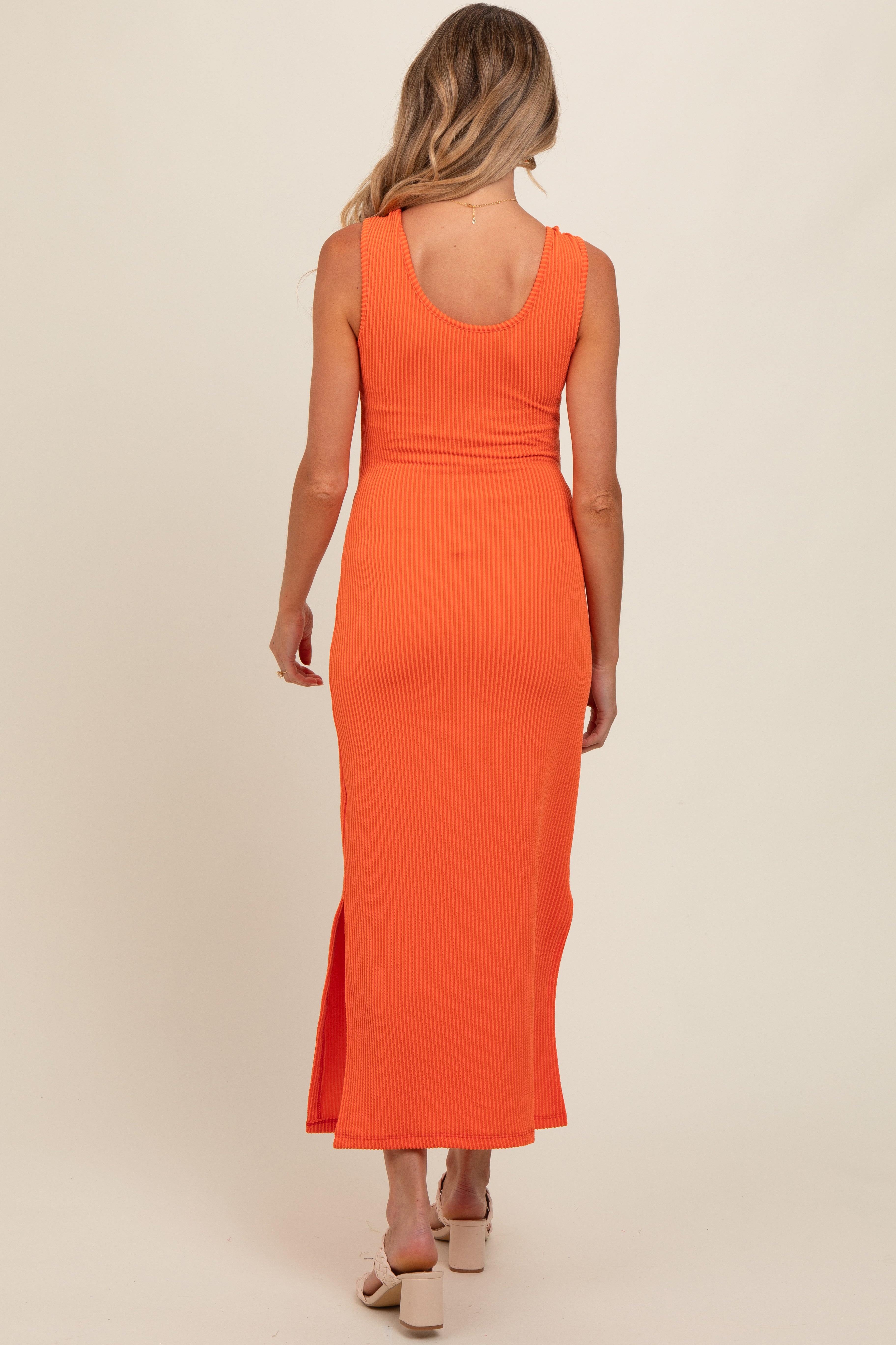 Orange side slit maternity dress styled for pregnancy wear