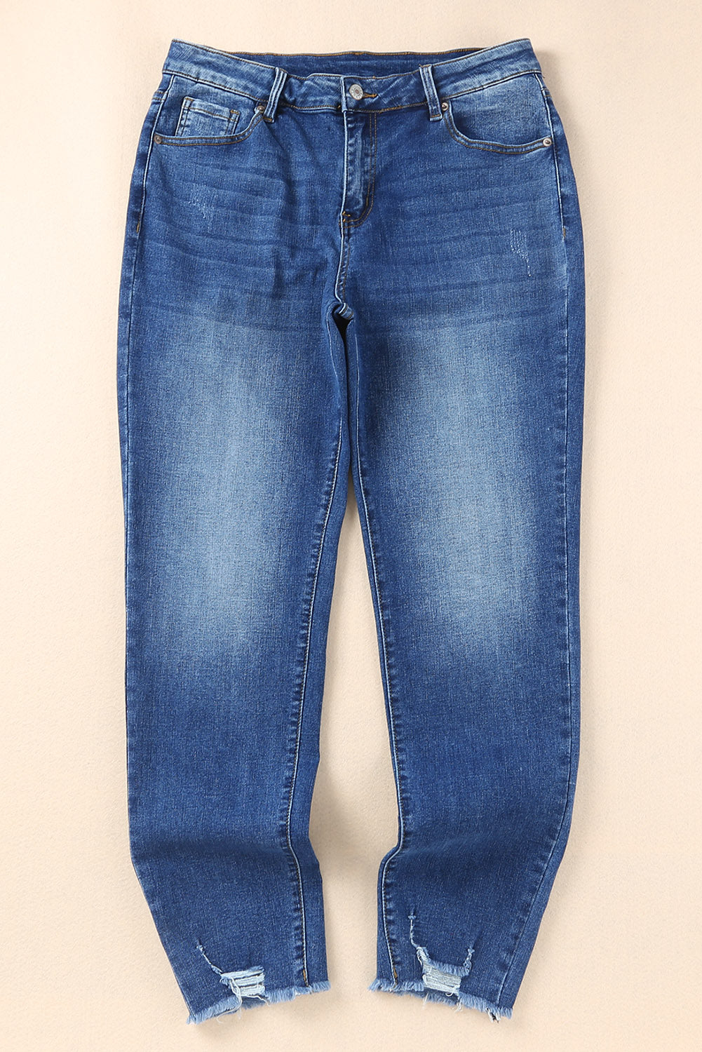 Chic blue ankle-length skinny jeans with raw hem detail