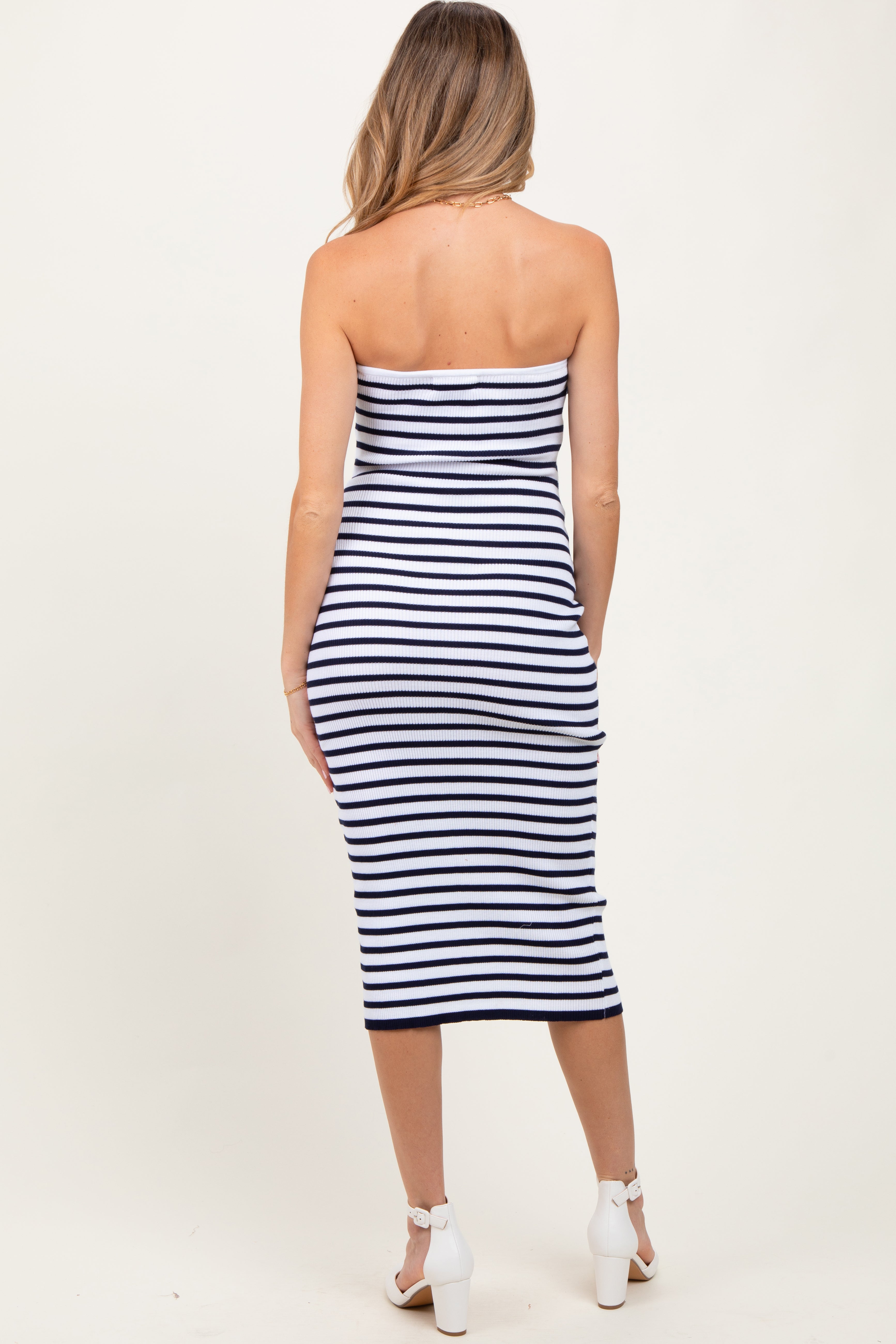 Navy striped strapless maternity dress styled on pregnant model