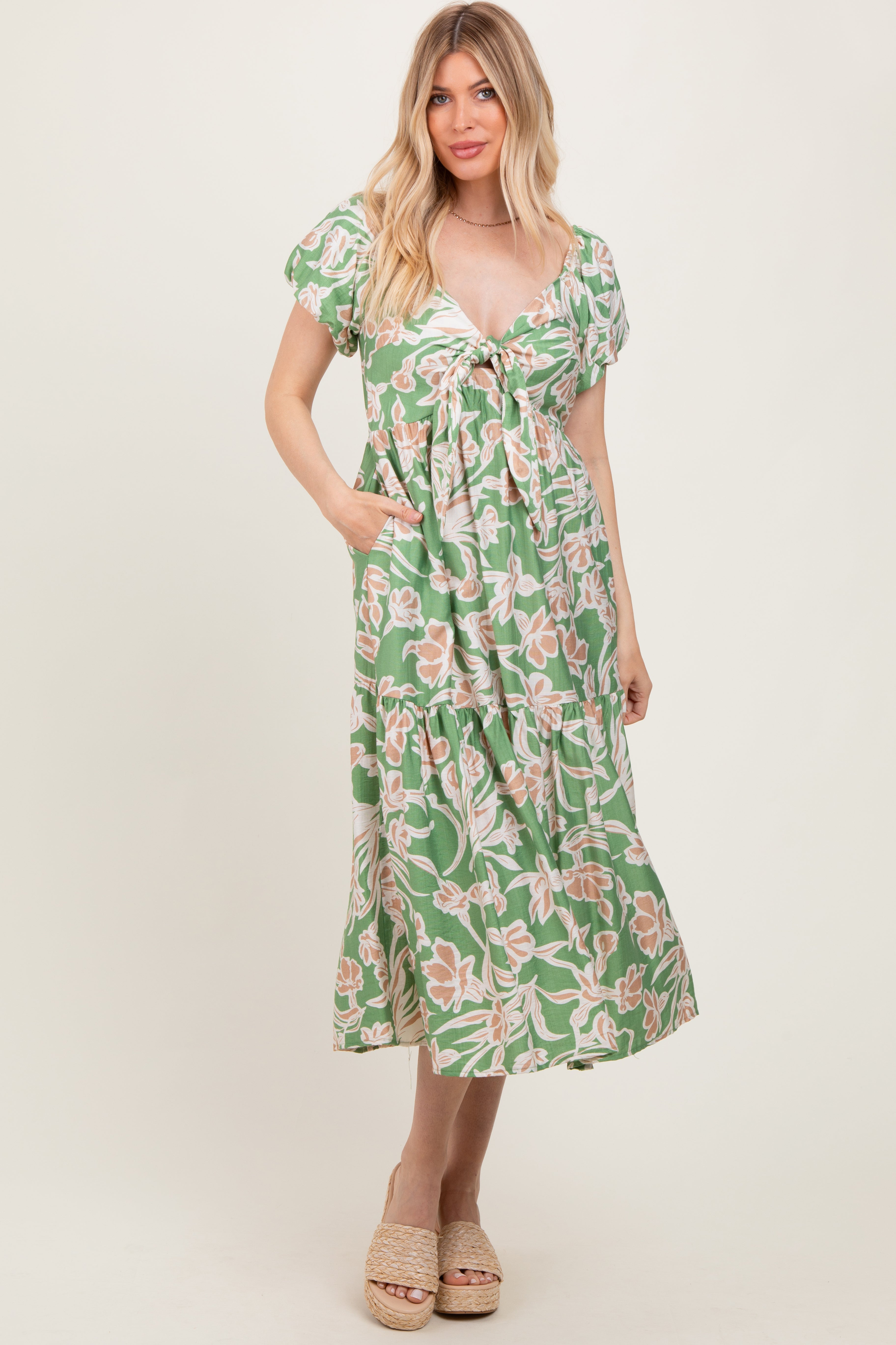Green floral midi dress front tie detail and flowing fabric drape