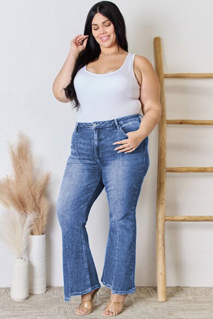 Stylish blue high-waist plus size flare jeans with exposed seam detail