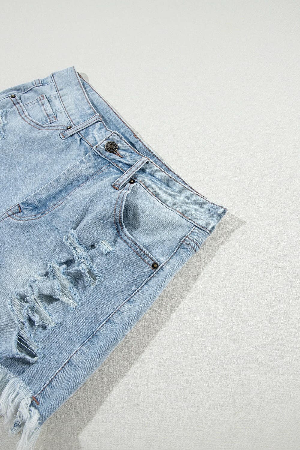 Distressed Raw Hem Denim Shorts.