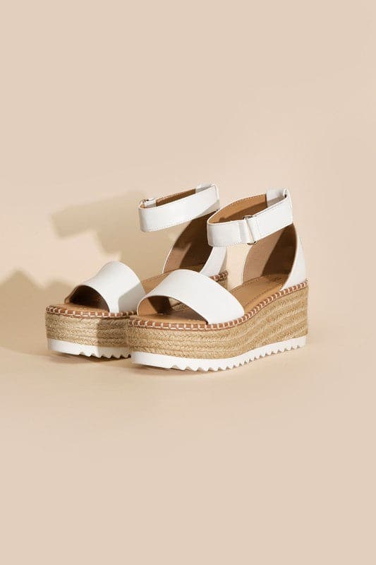 TUCKIN-S PLATFORM SANDALS.