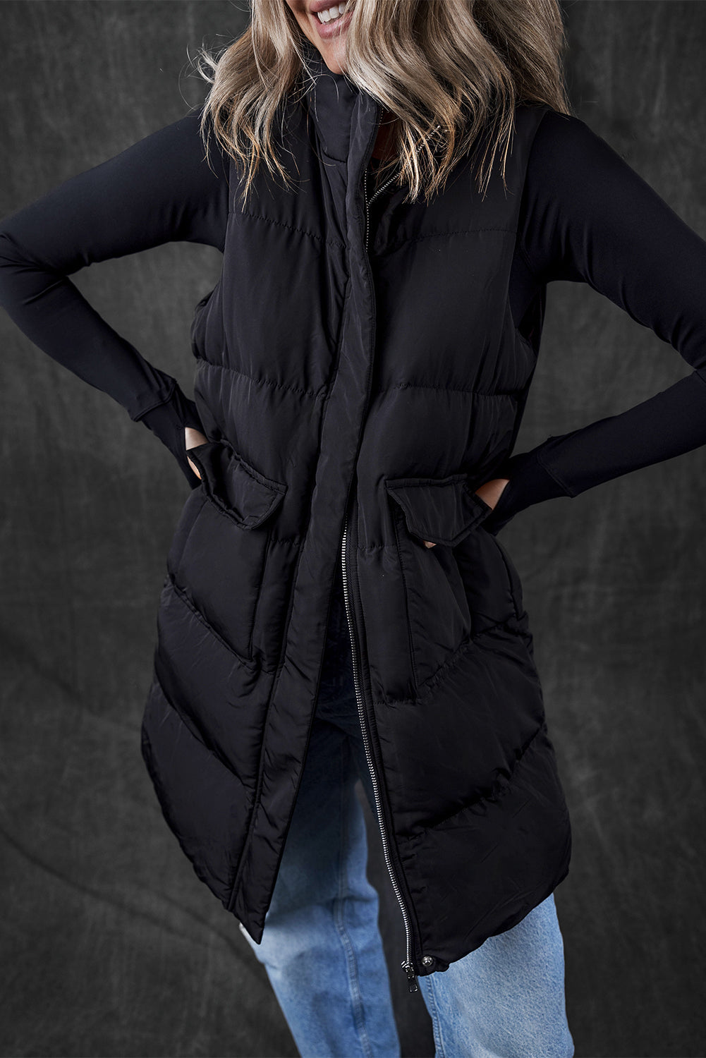 Stylish black longline windproof puffer vest with convenient pockets