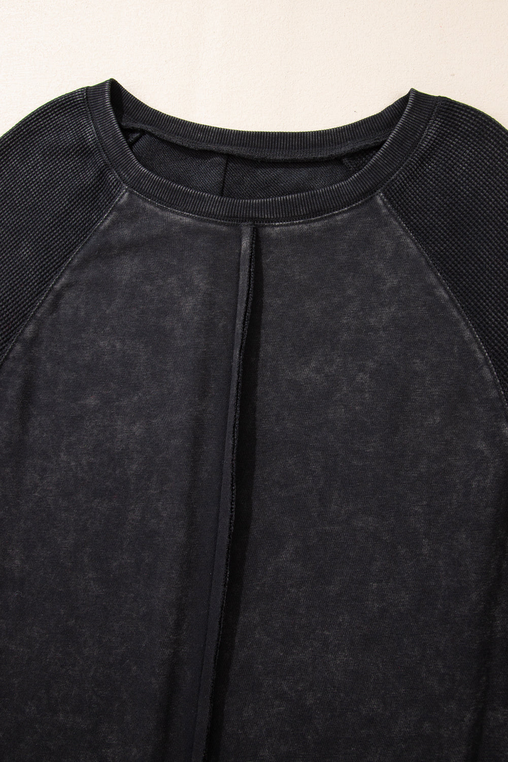 Chic black waffle knit raglan sleeve sweatshirt with patchwork detail