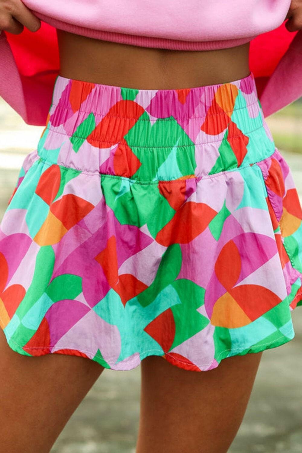 Smocked contrast print high waist skort in vibrant colors.