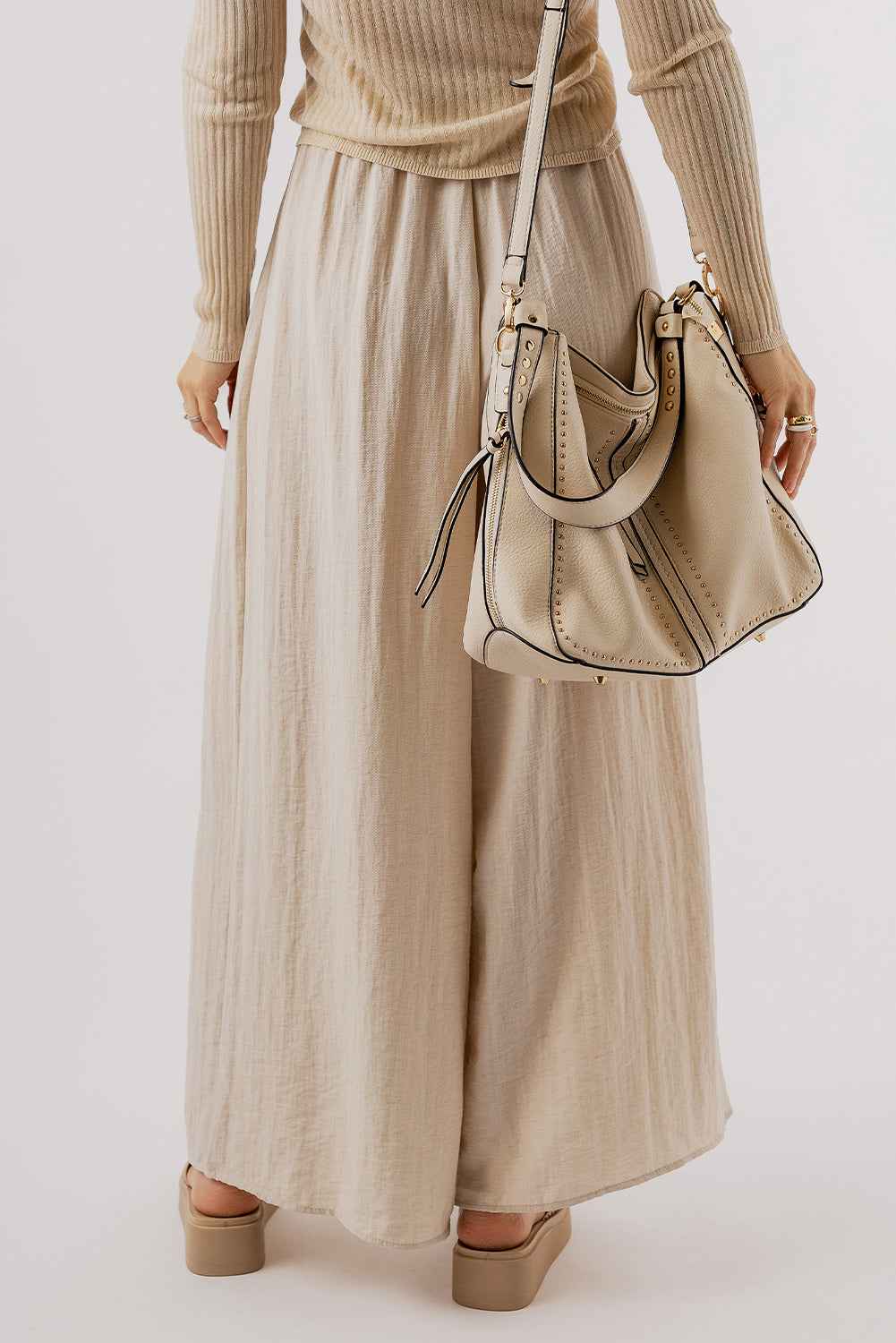 Beige high-waisted wide-leg trousers