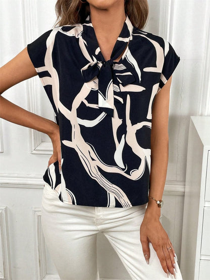 Printed Tie Neck Cap Sleeve Blouse.