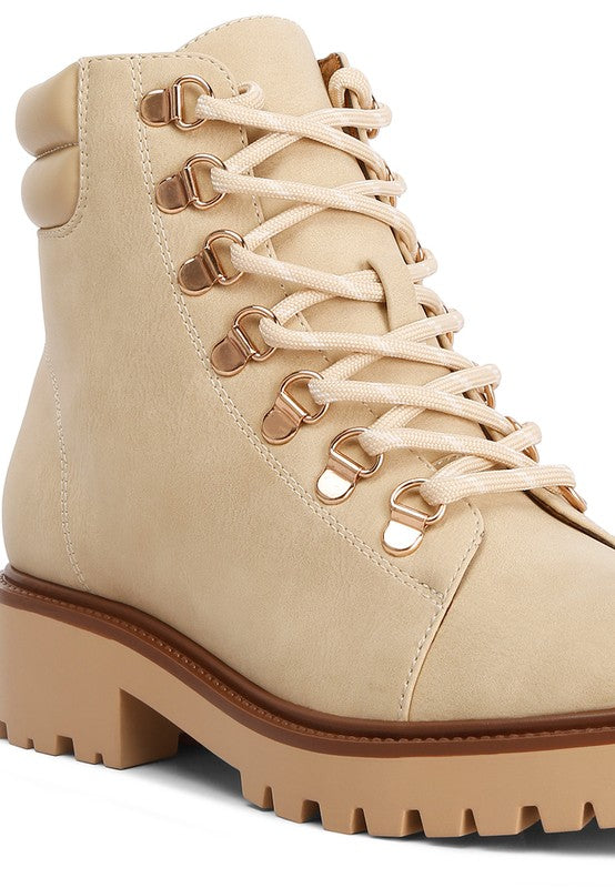 Beige lace-up boots with brown accents