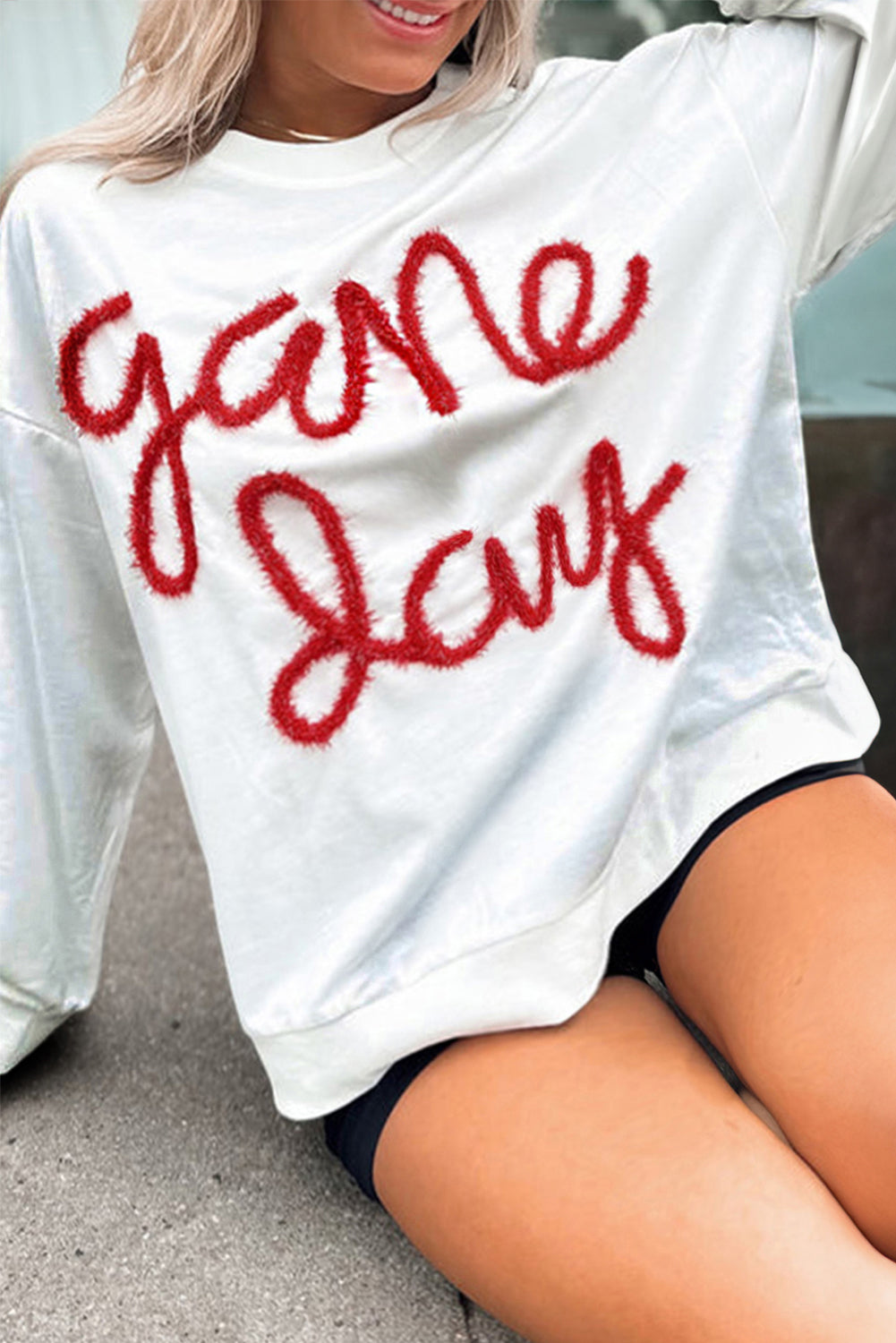 Festive white plus size rugby game day sweatshirt with tinsel accents