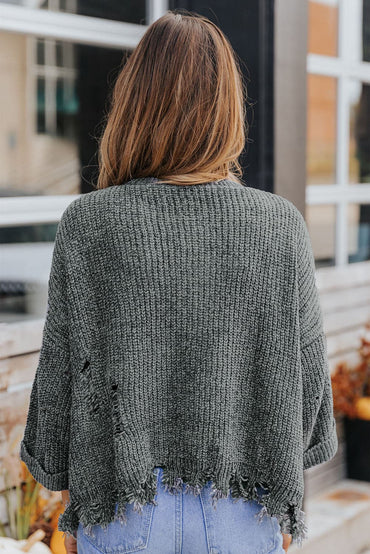 Distressed Pocketed Raw Hem Sweater.