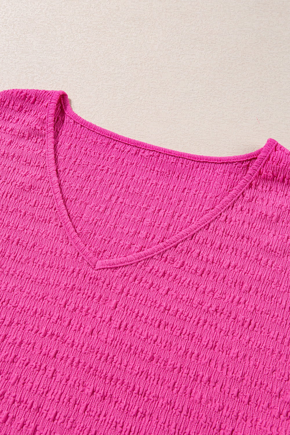 Chic bright pink plus size textured V-neck tee with folded sleeves