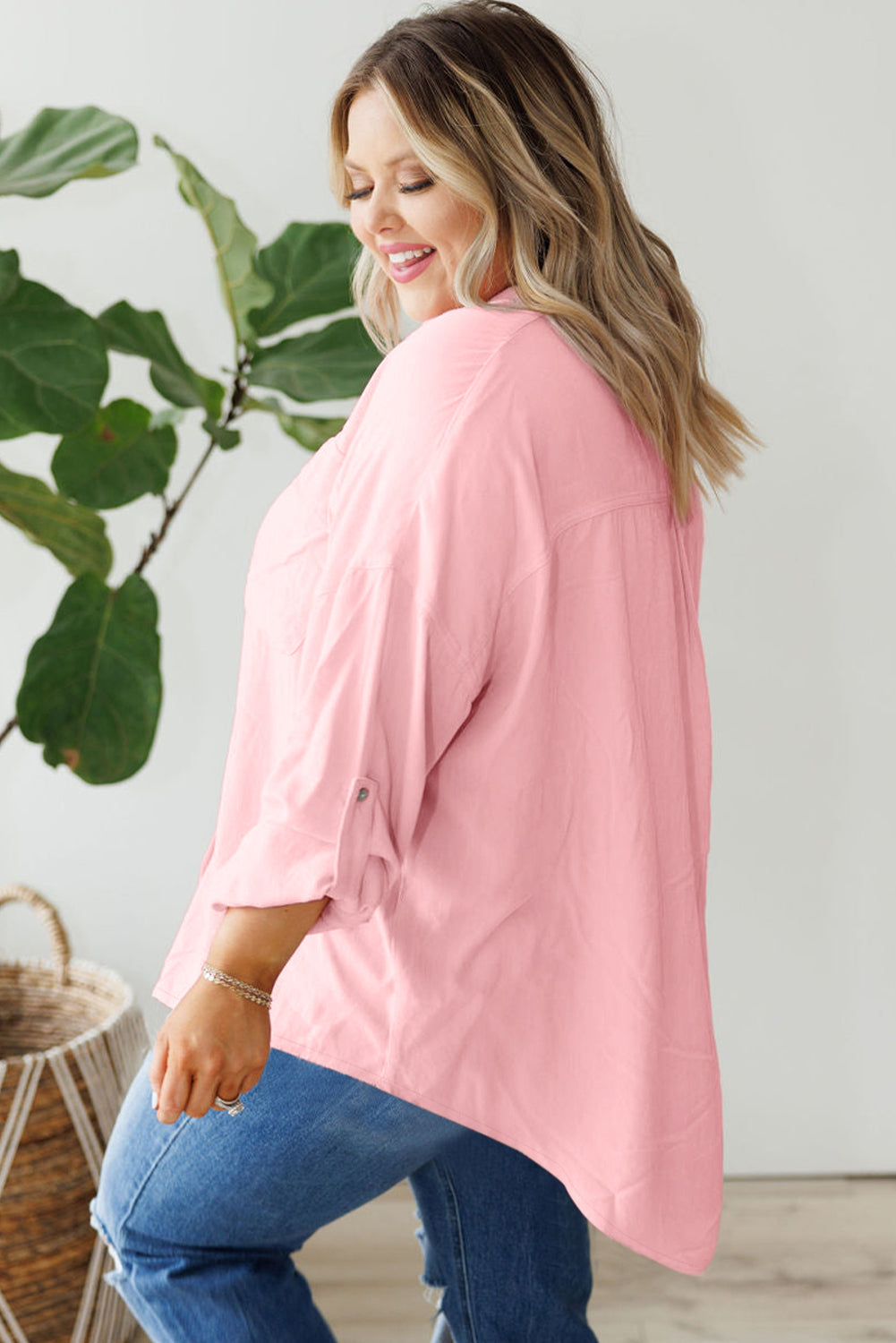 Chic pink plus size button-down shirt with flap pockets and roll-tab sleeves