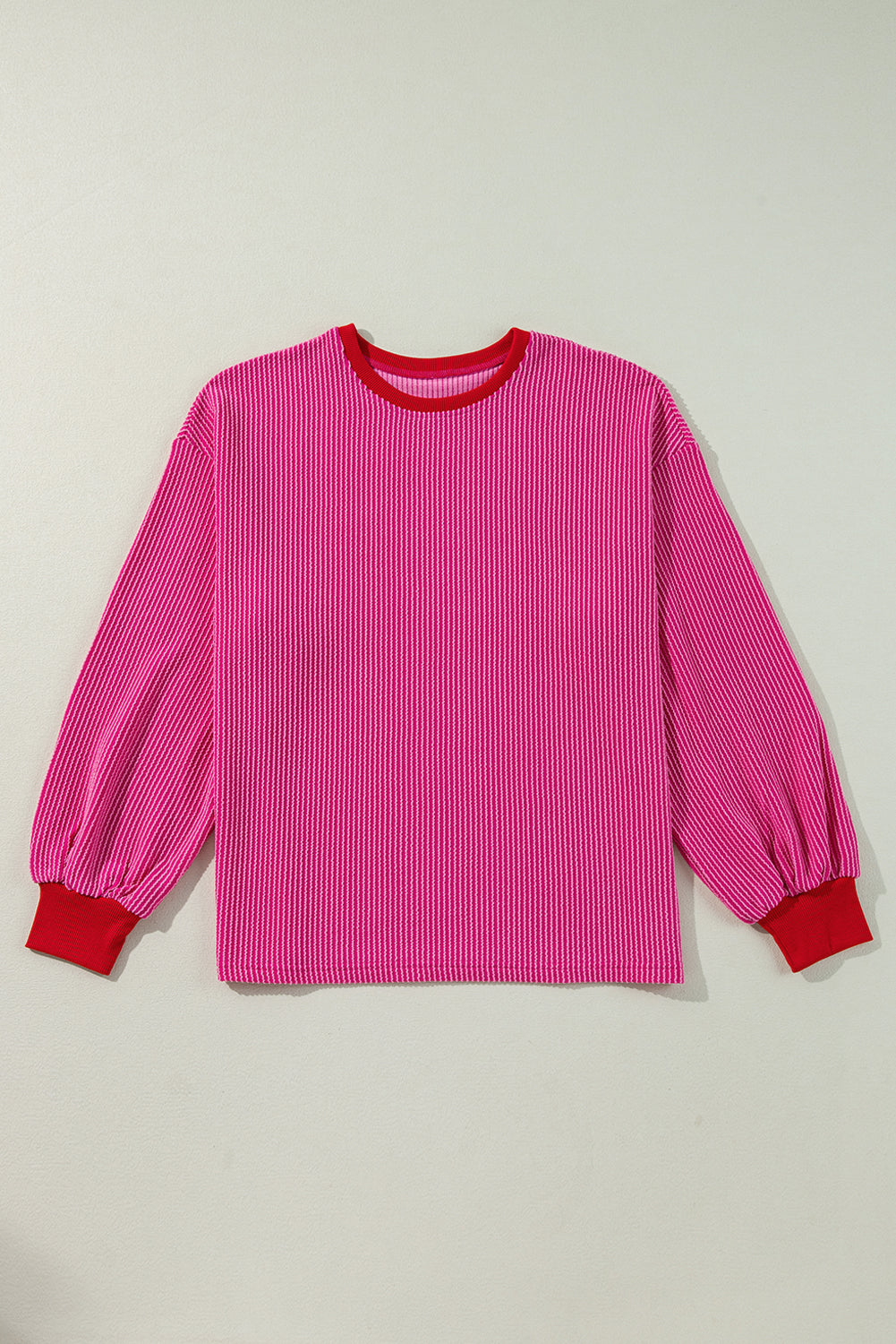 Vibrant pink corded edge drop shoulder long sleeve top