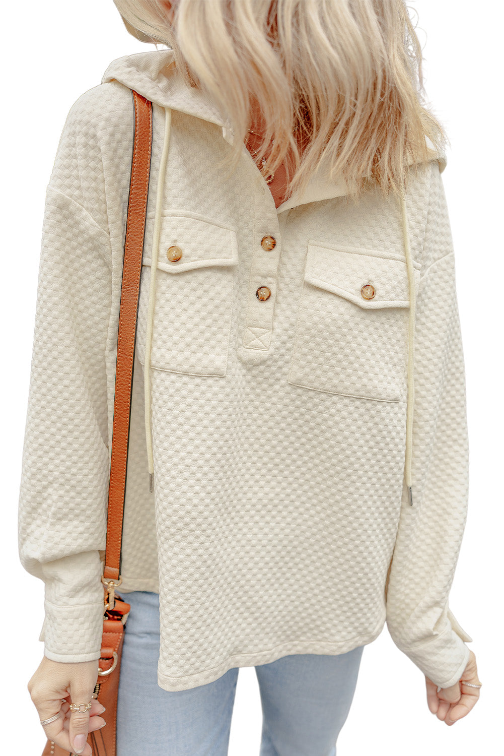 Chic apricot hoodie with buttoned neckline and functional pockets