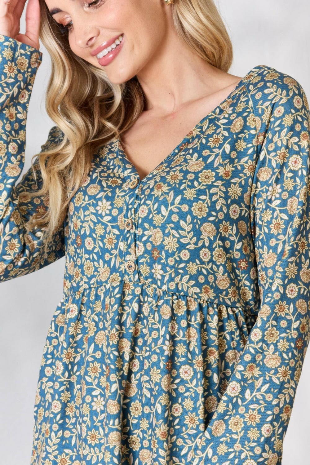 Heimish Full Size Floral Half Button Long Sleeve Blouse.