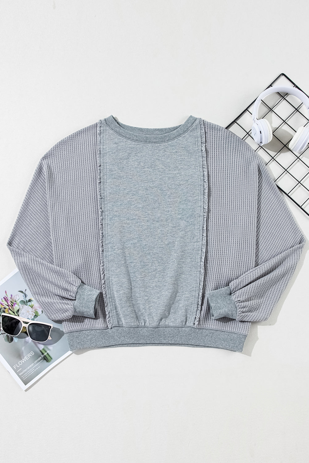 Chic light grey waffle patchwork pullover with raw hem details