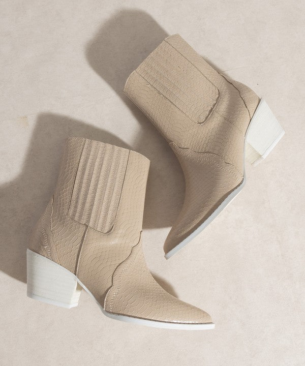 Western-inspired Chelsea bootie with elegant stitch detailing