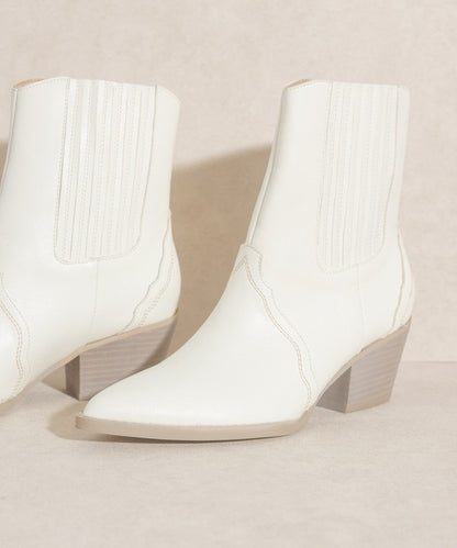 Western-inspired Chelsea bootie with elegant stitch detailing