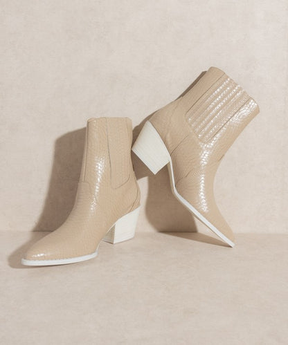 Western-inspired Chelsea bootie with elegant stitch detailing