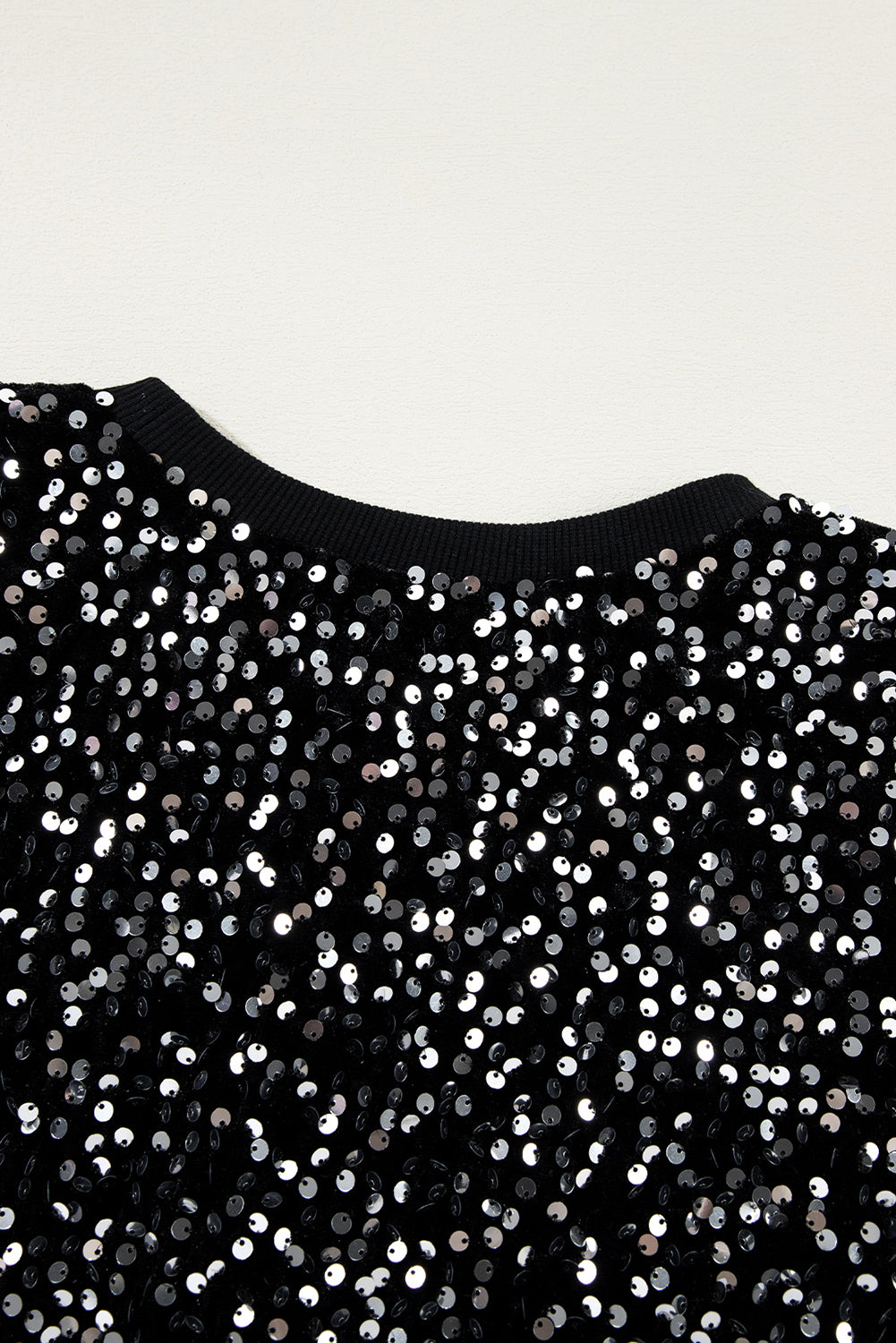 Glamorous black sequined cropped blouse with long sleeves